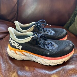Hoka Black and Gray Running Shoes with Orange and Pink Accents